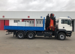 Used truck MAN TGA 310, 6x4 year 2004 with 200.070km, with open box and crane Palfinger PK44002C.